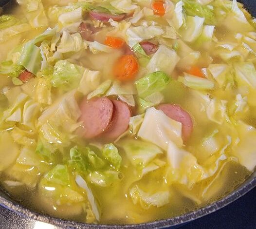 “Hearty German Cabbage Soup with Smoked Sausage”